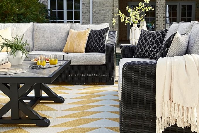 Signature Design by Ashley Beachcroft Casual Nuvella Weather Resistant Fabric Outdoor/Indoor Sofa with Cushion and 2 Toss Pillows, Black & Light Gray
